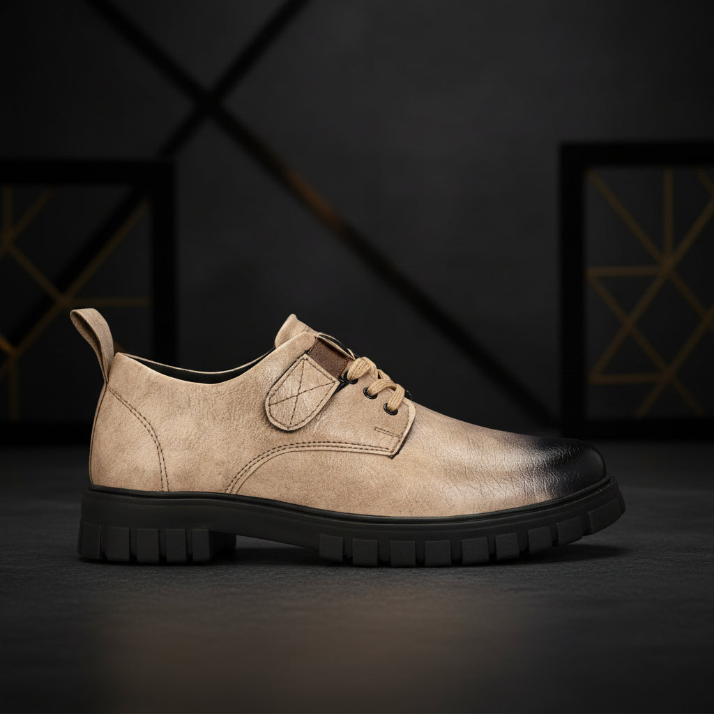 Beige leather shoe with black sole on a white background