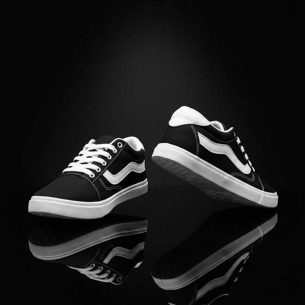 Black and white sneakers shown from the side on a white background