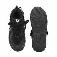 Black sneaker with sole view on a white background