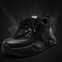 Black sneaker with laces on a white background