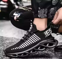 Black and white sneaker with unique sole design on a blurred street background
