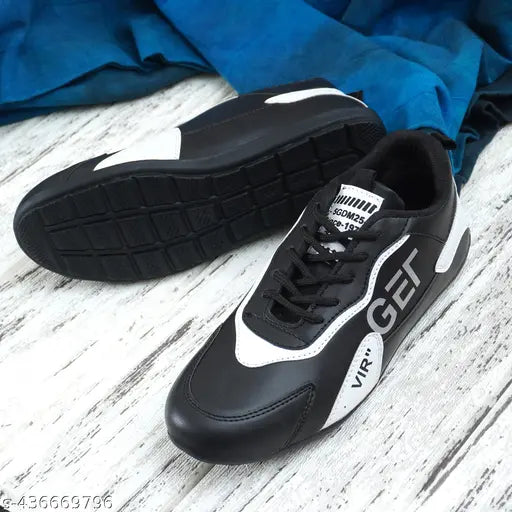 Black and white sneakers with visible branding on a wooden floor.